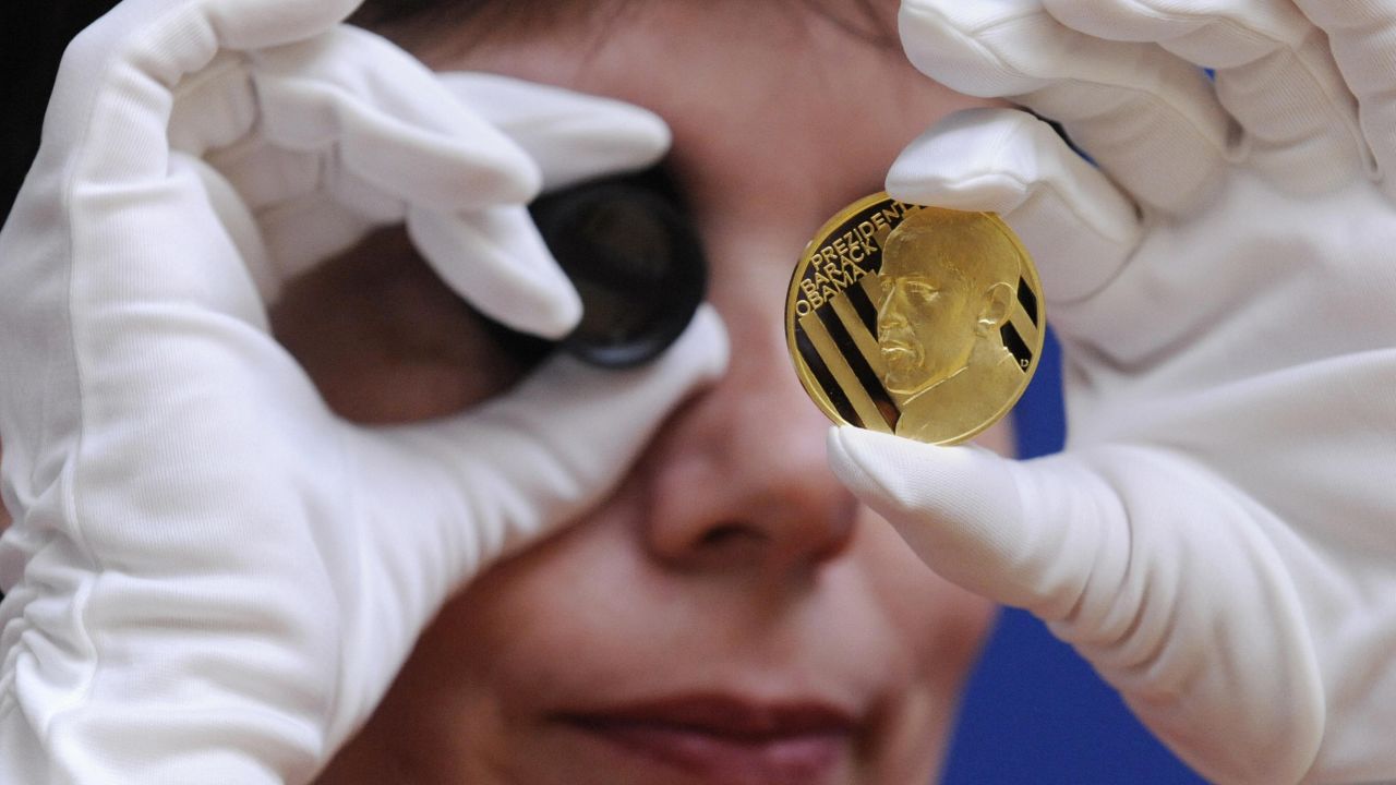 CZECH REPUBLIC: An employee of the Jablonex mint checks the quality of a commemorative gold medal featuring Obama on March 31, 2009, in Jablonec nad Nisou.