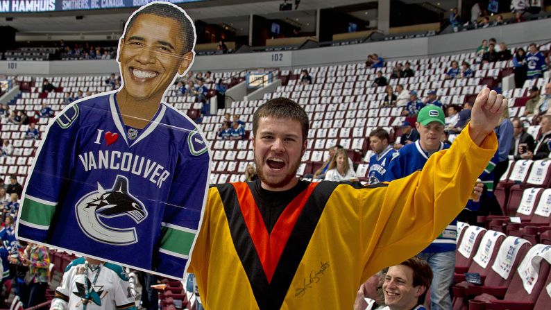 CANADA: A Canucks fan holds a cutout of Obama before the Canucks take on the San Jose Sharks in Game Five of the Western Conference Finals during the 2011 NHL Stanley Cup Playoffs on May 24, 2011, in Vancouver, British Columbia.
