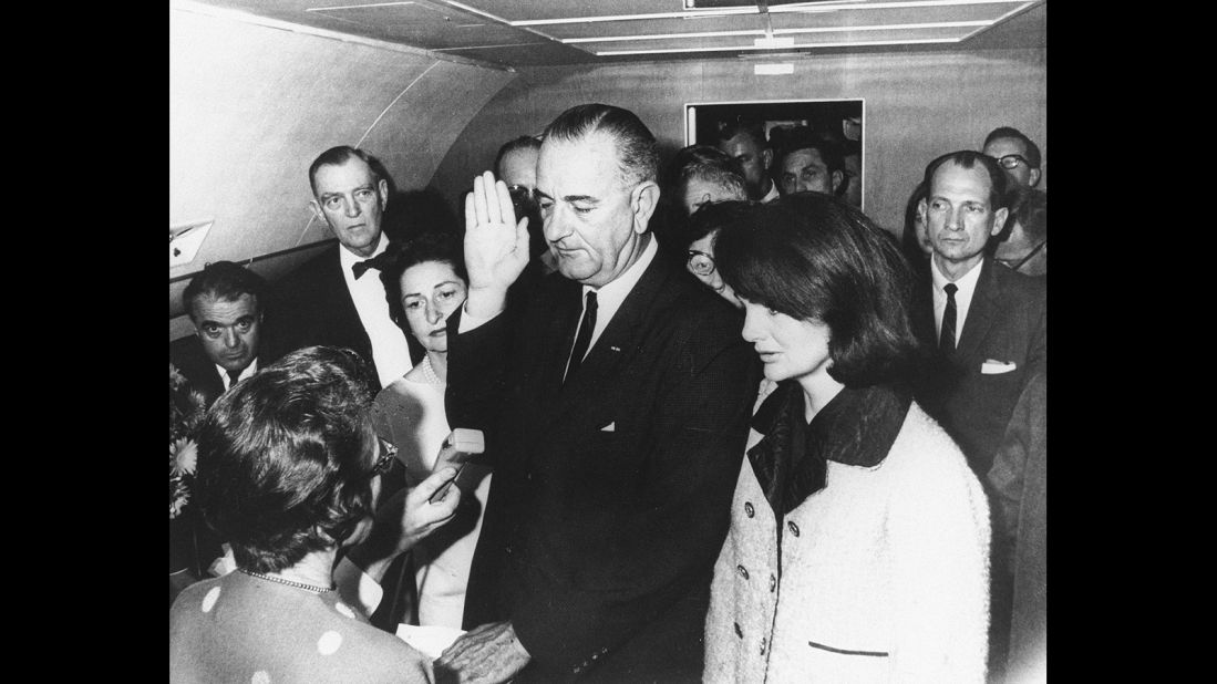 Lyndon B. Johnson takes the oath of office aboard Air Force One after the assassination of John F. Kennedy in November 1963. Standing on the right is Kennedy's widow, Jackie.