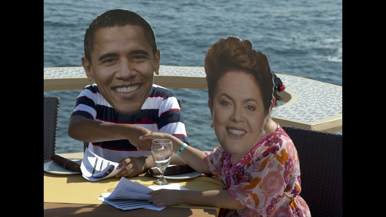 MEXICO: Members of the international organization OXFAM wear masks of Obama and Brazilian President Dilma Rousseff during a protest in Baja California on the eve of the G-20 summit on June 17, 2012.