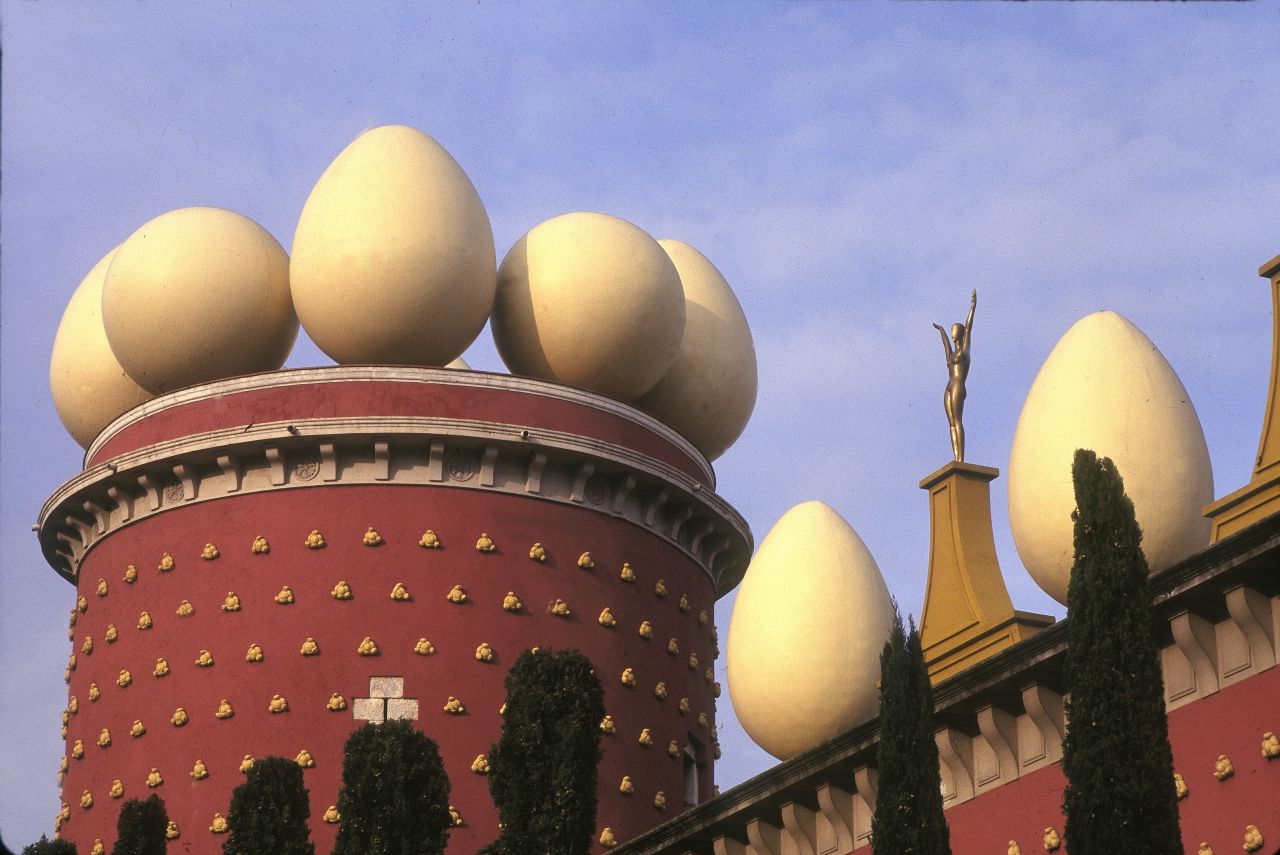 Built in 1974 on the site of the town's former theater, this <a href="http://www.salvador-dali.org/museus/figueres/en_index.html" target="_blank" target="_blank">inventive building</a> holds the world's largest collection of Salvador Dali artwork. <br /><br />Those not familiar with the surrealist artist's work might think that the large egg sculptures perched atop a dome and surrounding brick "castle" might just be a gimmick. Once inside, however, you realize the flamboyant façade pales in comparison to the wacky curiosities awaiting visitors. <br /><br />More than 20 years after Dali's death, Figueres -- the town where he was born and later died -- continues to honor the eccentric master with a crypt containing his grave in the center of the museum.  