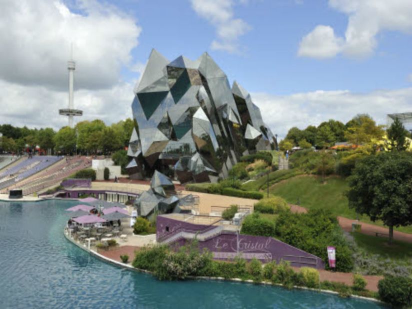 Symbolizing rock crystals thrusting out of the earth, this alluring building is one of the original pavilions created for the unique leisure park, <a href="http://en.futuroscope.com/" target="_blank" target="_blank">Futuroscope</a>. <br /><br />It houses one of the park's many IMAX theaters -- with a screen measuring 6,458 square feet (the size of two tennis courts) and a 440-seat capacity. Great care was taken before the creation of this architectural marvel; a large-scale Plexiglas model was built using 3,000 plates -- thousands of hours were spent calculating its complex angles on computerized simulators. Even maintenance requires special skills. All window cleaners are required to be professional mountaineers.<br />(Image: Courtesy Gerald Buthaud, D Laming, Architects, Futuroscope)