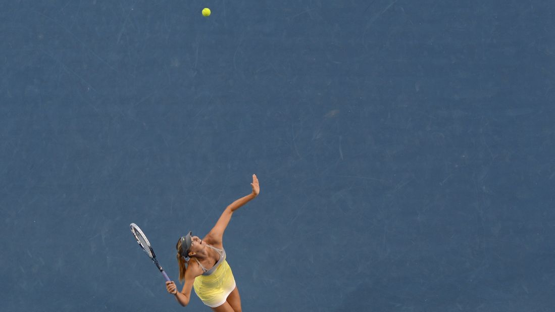 Sharapova serves against Williams during their women's singles match on January 18.