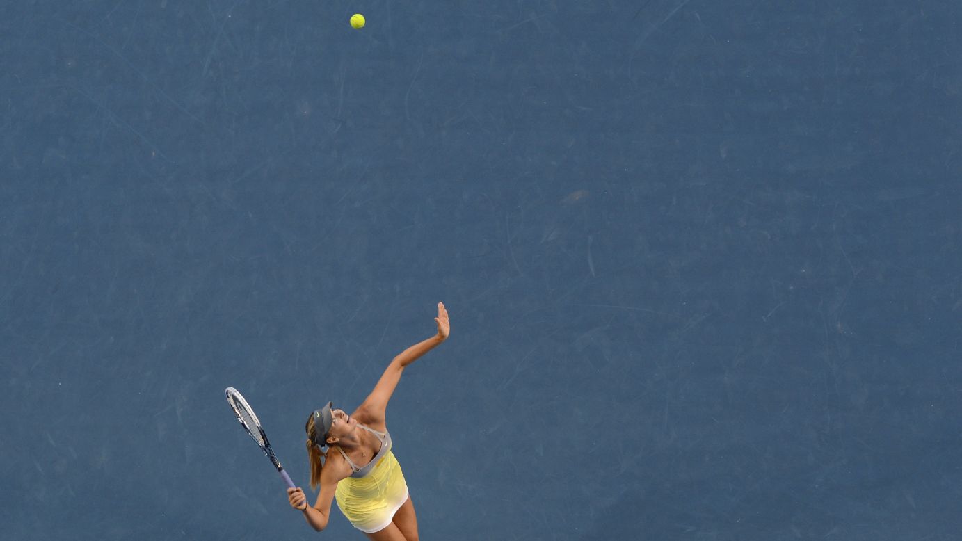 Sharapova serves against Williams during their women's singles match on January 18.
