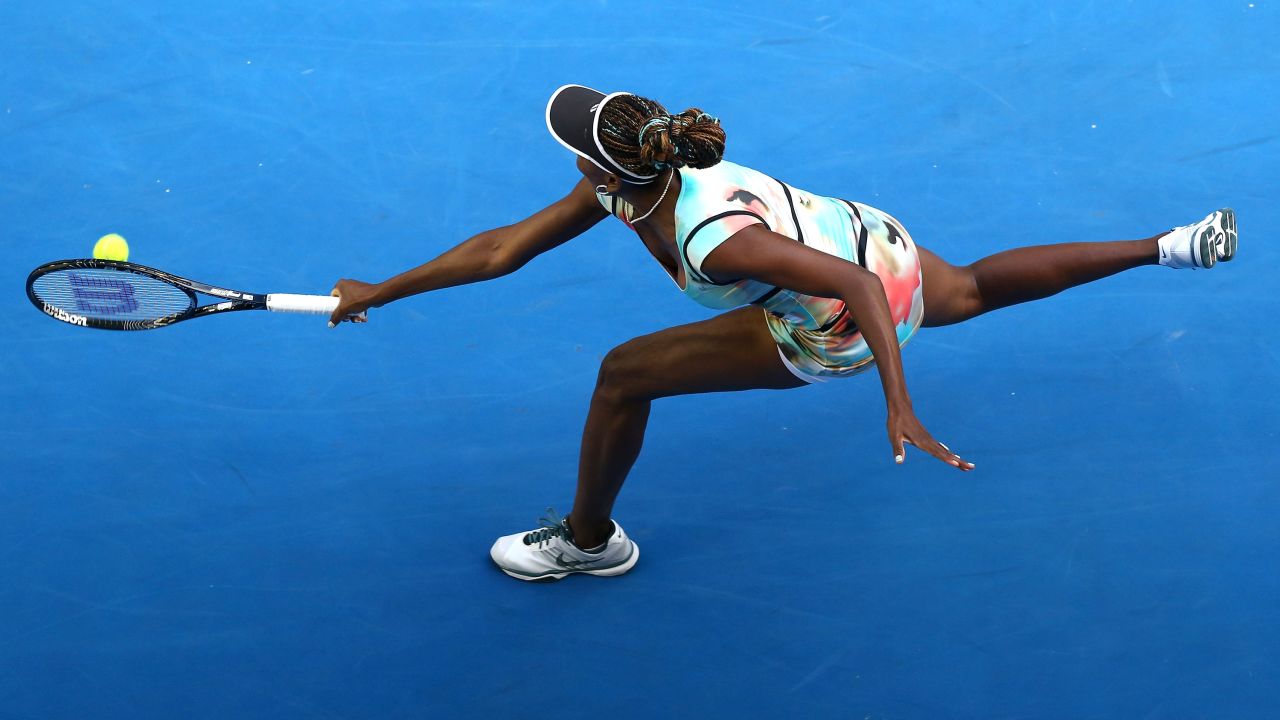 Williams plays a backhand in her third-round match against Sharapova on January 18.