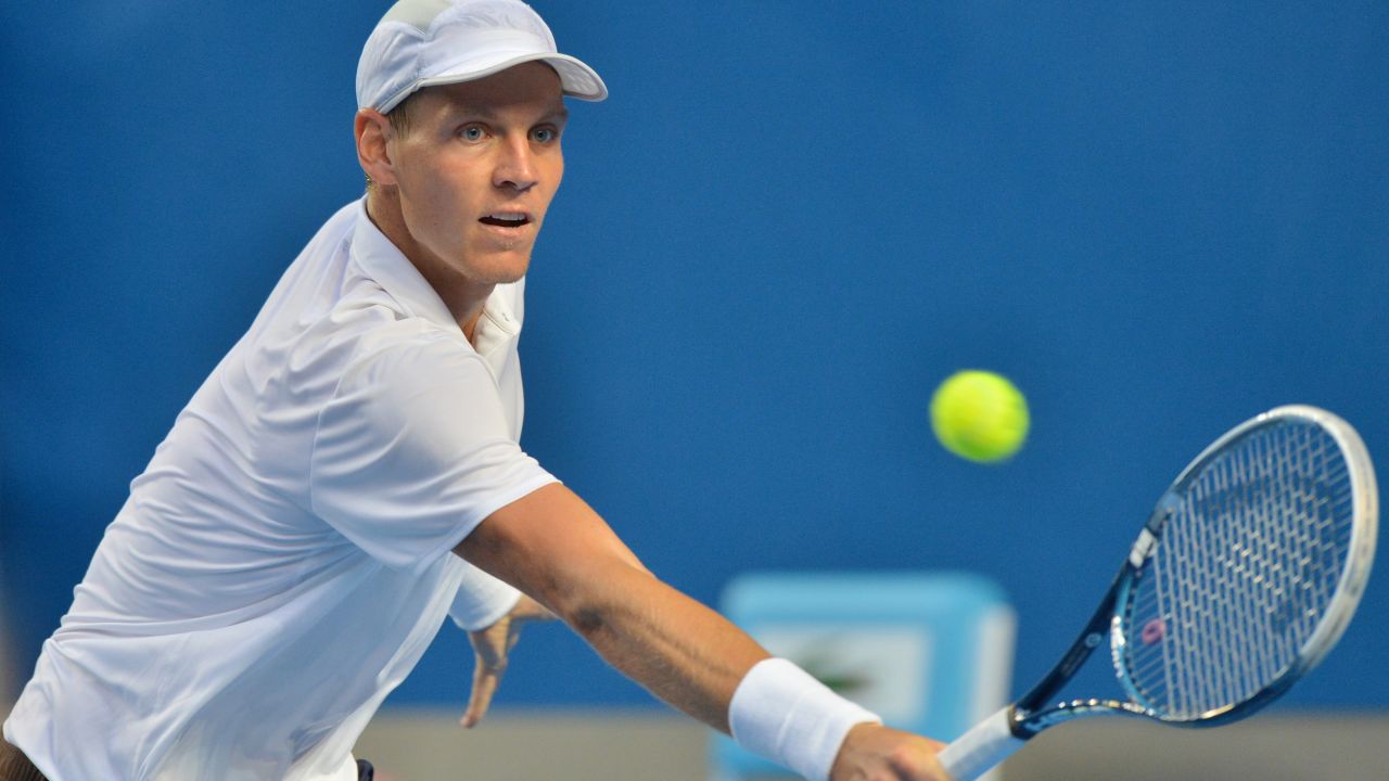 Berdych plays a return during his men's singles match against Melzer on January 18.