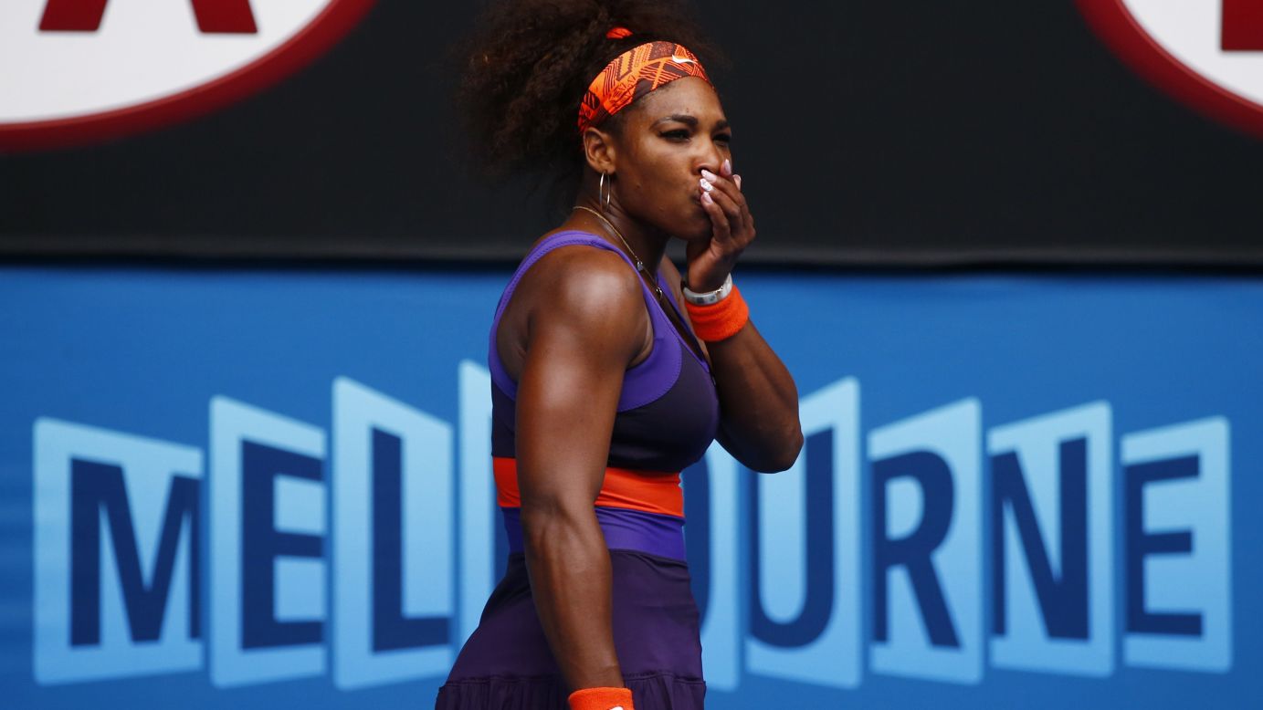 Serena Williams of the U.S. holds her mouth after hitting herself with her racket during her women's singles match against Garbine Muguruza Blanco of Spain during Day Four of the 2013 Australian Open on Thursday, January 17, in Melbourne, Australia. Williams won 6-2, 6-0.