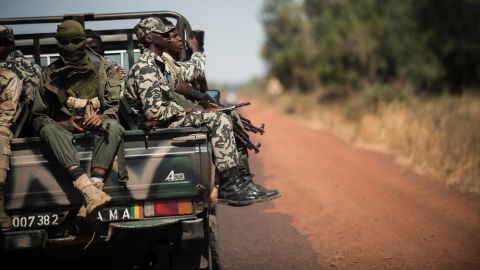 Malian soldiers sit in a truck on their way to Niono, Mali, on Friday, January 18. 