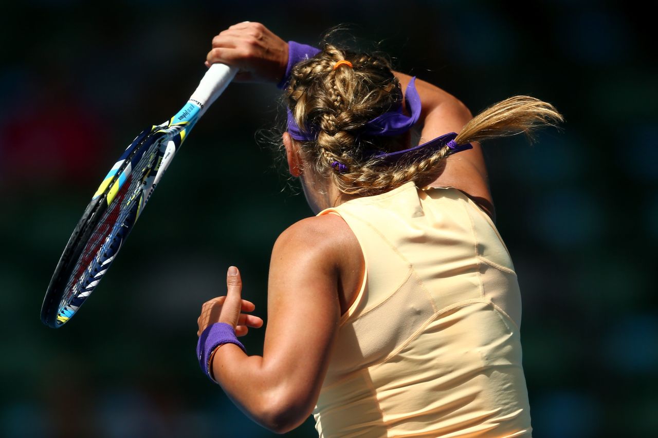 Victoria Azarenka of Belarus plays a forehand in her third-round match against Jamie Hampton of the United States.