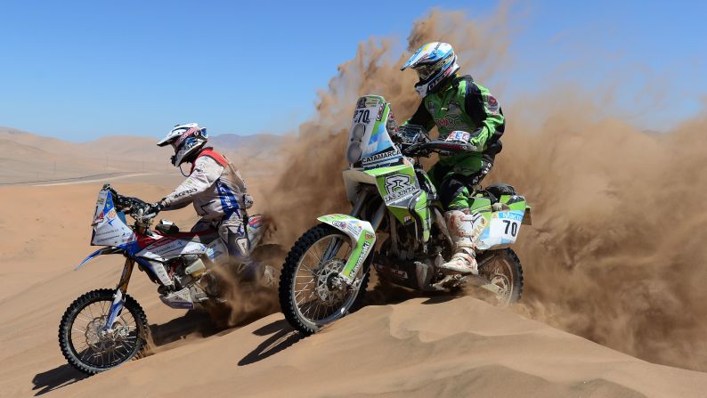 Diego Demelchori and Simon Pavey race over a dune on January 18 in Copiapo, Argentina.