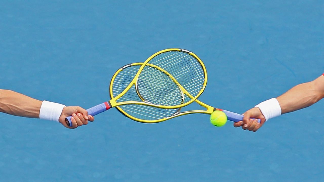 The racquets of Bob Bryan of the United States and Mike Bryan of the United States cross as they compete in their men's second round doubles match against Flavio Cipolla of Italy and Andreas Seppi of Italy on Friday, January 18. The Bryan brothers won 6-3, 6-4.