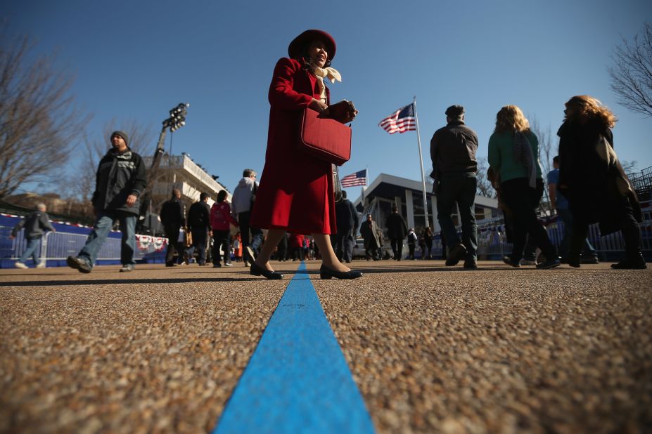Christian evangelist Mary Clement of Silver Spring, Maryland, sings and reads from her Bible as she walks along Pennsylvania Avenue outside the White House on Sunday.