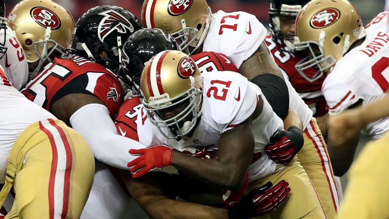 Frank Gore of the San Francisco 49ers runs the ball in the first quarter.