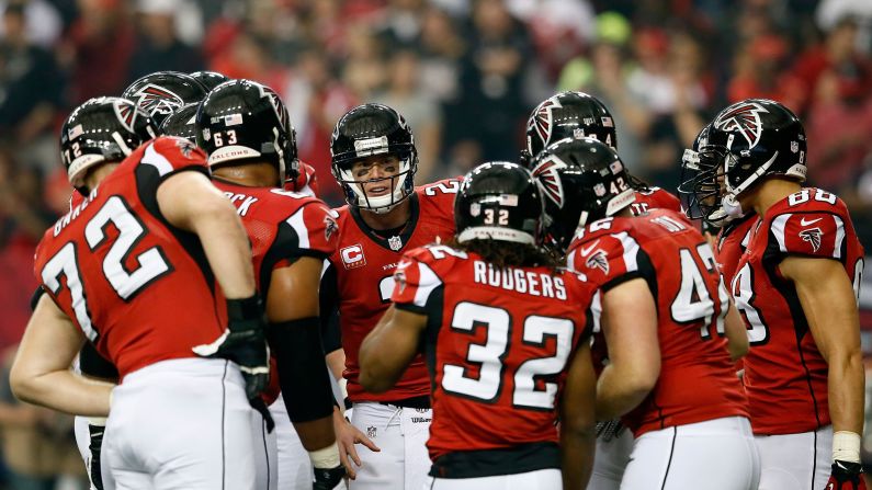 Falcons quarterback Matt Ryan, center, talks to his team in a huddle during the first half against the 49ers.