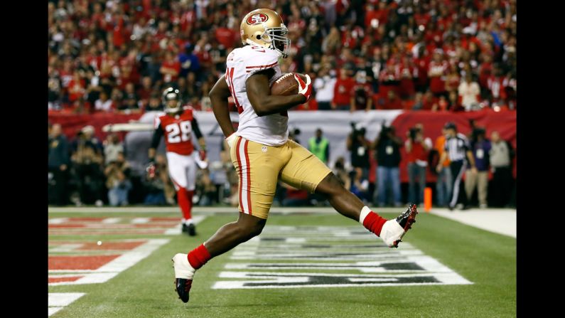 Frank Gore of the San Francisco 49ers scores a five-yard rushing touchdown in the third quarter.