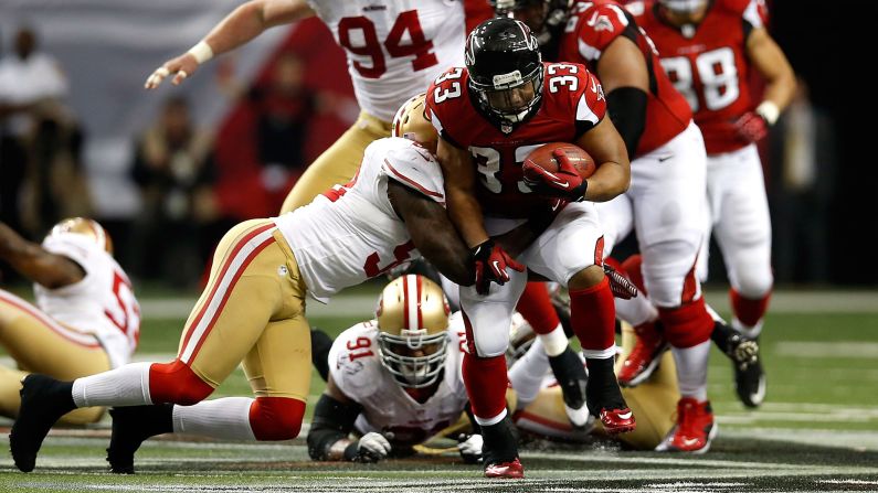 Michael Turner of the Atlanta Falcons runs the ball against the San Francisco 49ers.