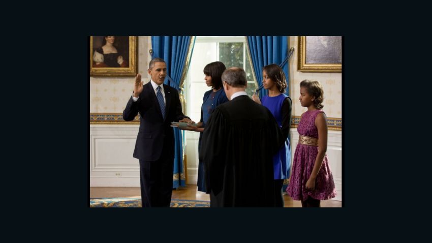 Supreme Court Chief Justice John Roberts administers the oath of office to President Barack Obama during the official swearing-in ceremony in the Blue Room of the White House on Inauguration Day, Sunday, Jan. 20, 2013. First Lady Michelle Obama, holding the Robinson family Bible, along with daughters Malia and Sasha, stand with the President. (Official White House Photo by Lawrence Jackson)