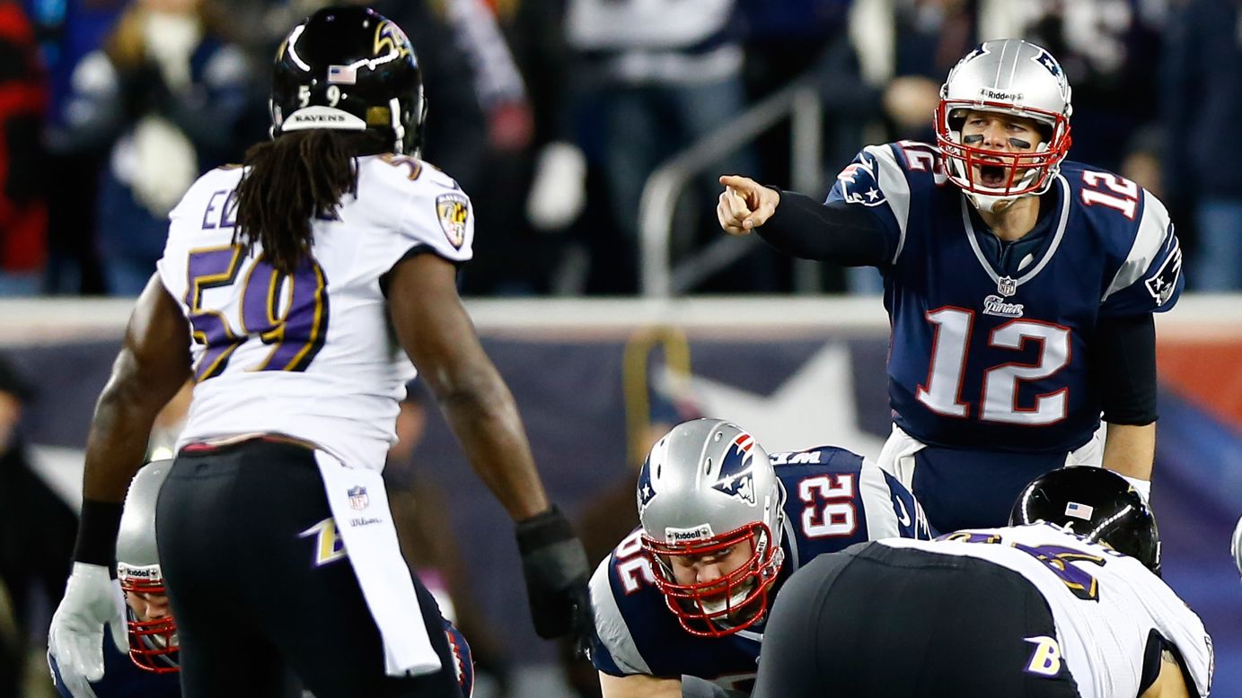 Patriots quarterback Tom Brady makes an adjustment at the line against the Ravens.