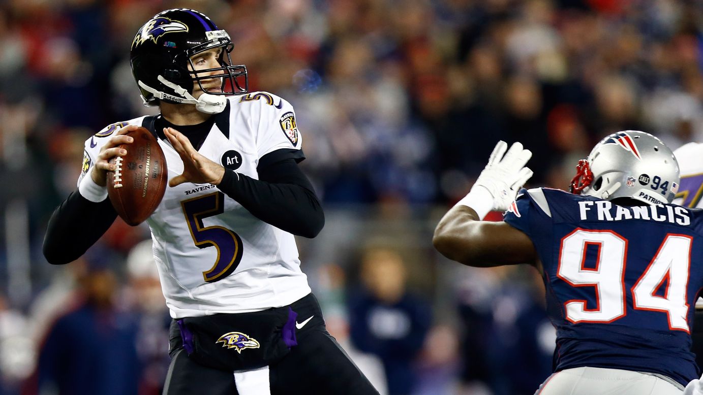 Ravens quarterback Joe Flacco gets pressured by Justin Francis of the New England Patriots.
