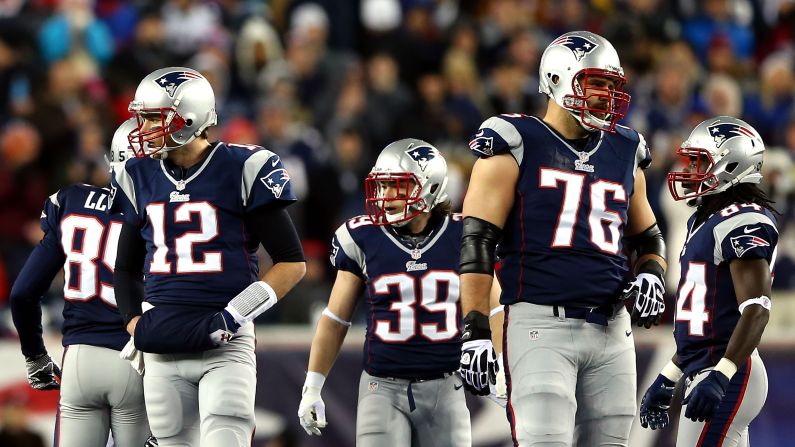 From left, Brandon Lloyd, Tom Brady, Danny Woodhead, Sebastian Vollmer and Deion Branch of the New England Patriots look on during the game against the Baltimore Ravens.