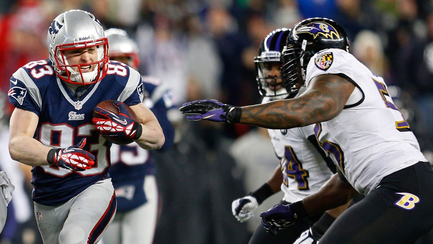 Wes Welker of the Patriots runs with the ball against the Baltimore Ravens.