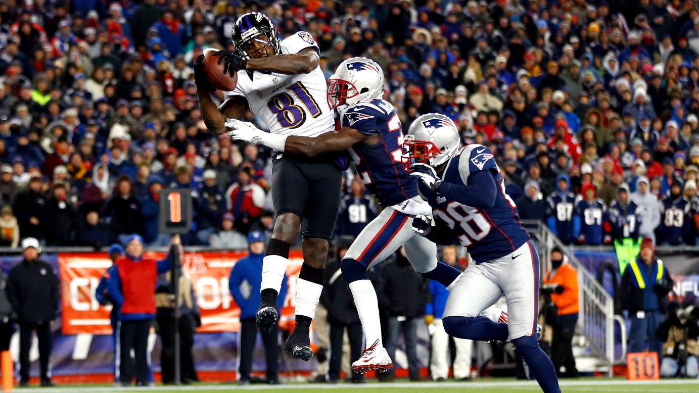 Anquan Boldin of the Ravens scores a touchdown against the Patriots.