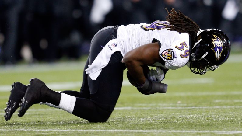 Dannell Ellerbe of the Baltimore Ravens intercepts a pass by Patriots quarterback Tom Brady.