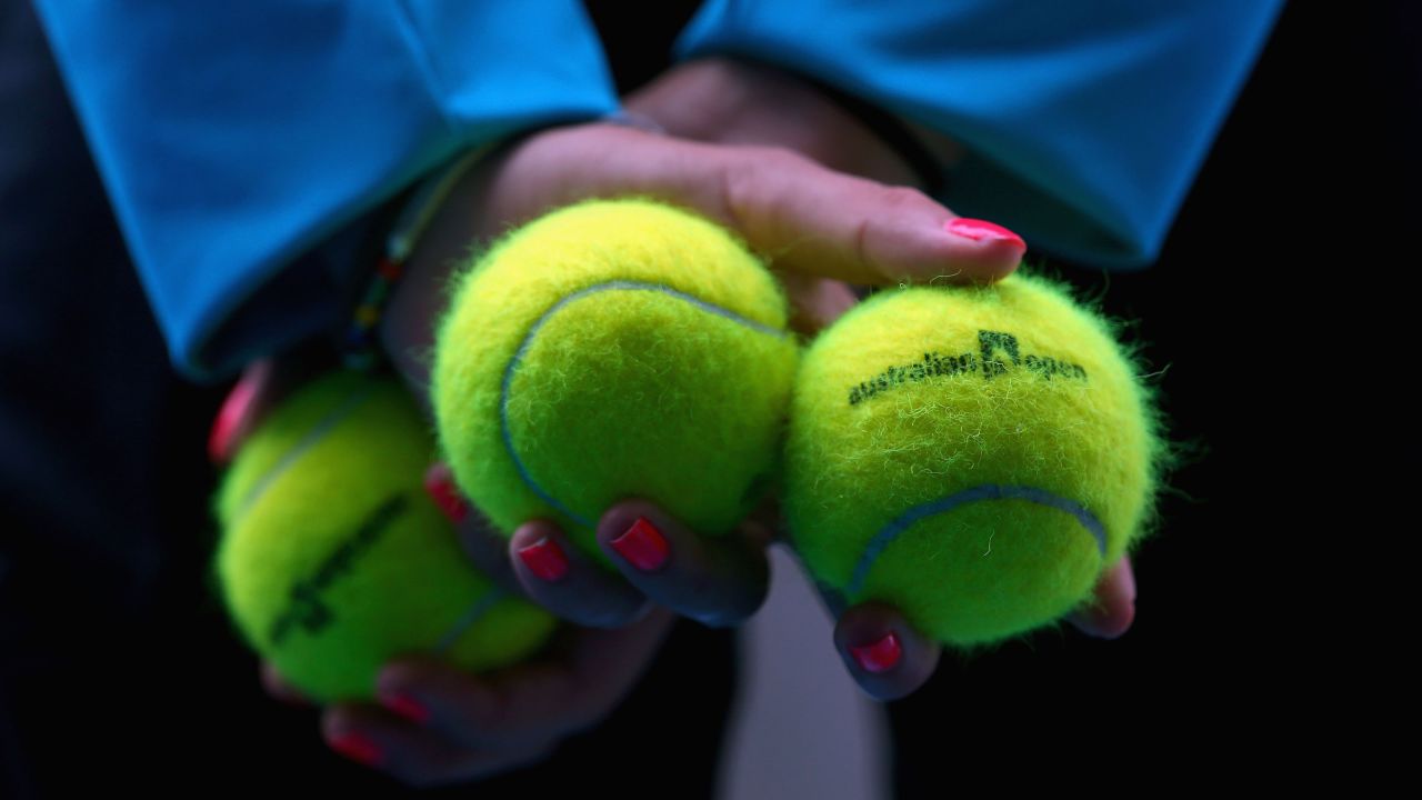 A ball kid displays Australian Open tennis balls during a match on January 21 at Melbourne Park.
