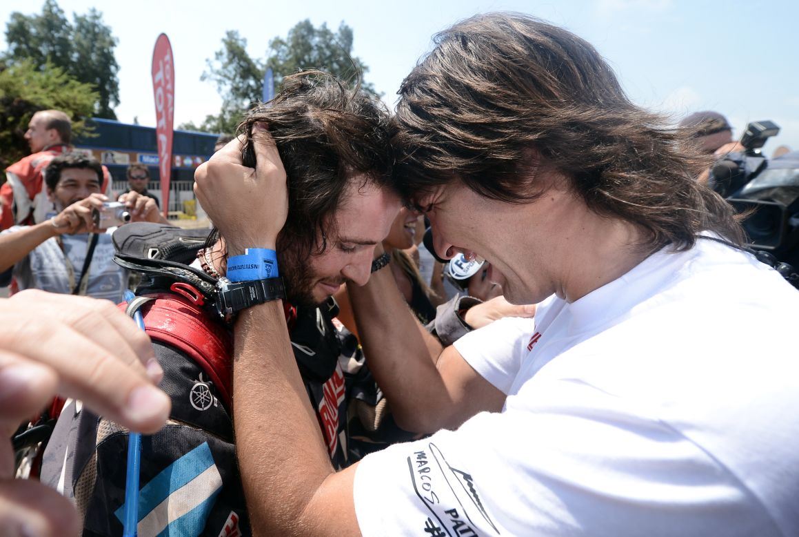 Argentinian ATV driver Marcos Patronelli, left, is congratulated by his brother Alejandro Patronelli after the 14th stage of the rally between La Serena and Santiago, Chile, on Saturday, January 19. Patronelli finished third in the final stage of the competition. 