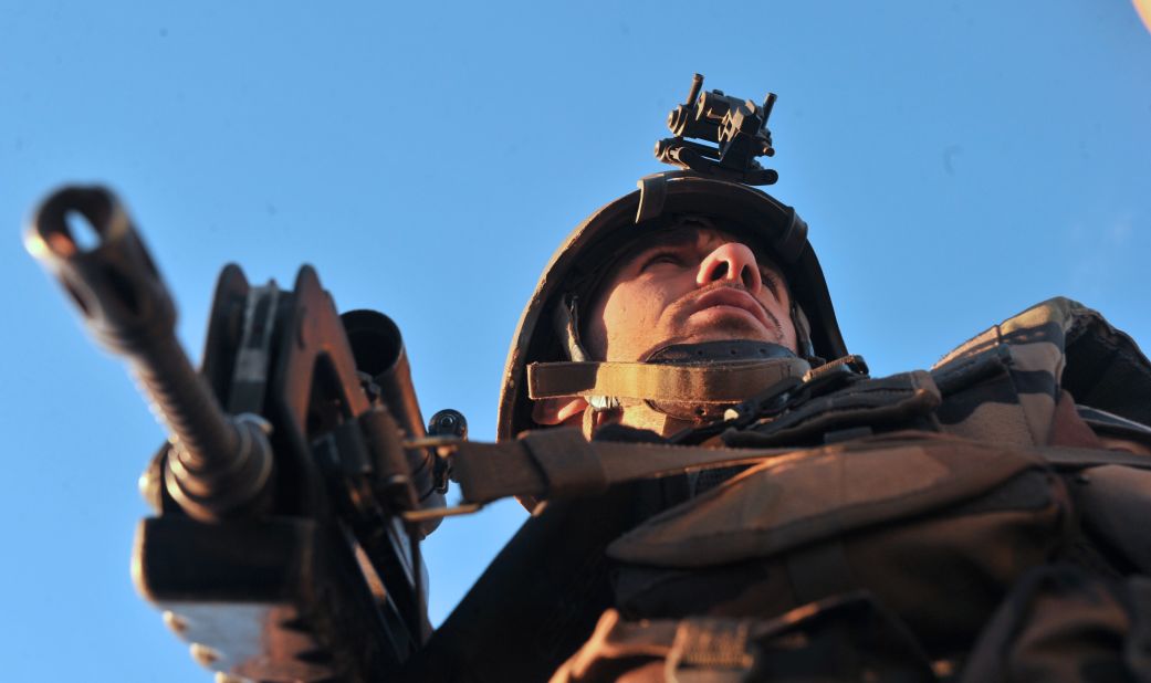 A French soldier looks around after arriving in Diabaly on January 21.