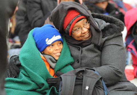Bonita Volcy and nephew Cullan King, 10, of Texas try to keep warm on the National Mall in Washington on Monday.