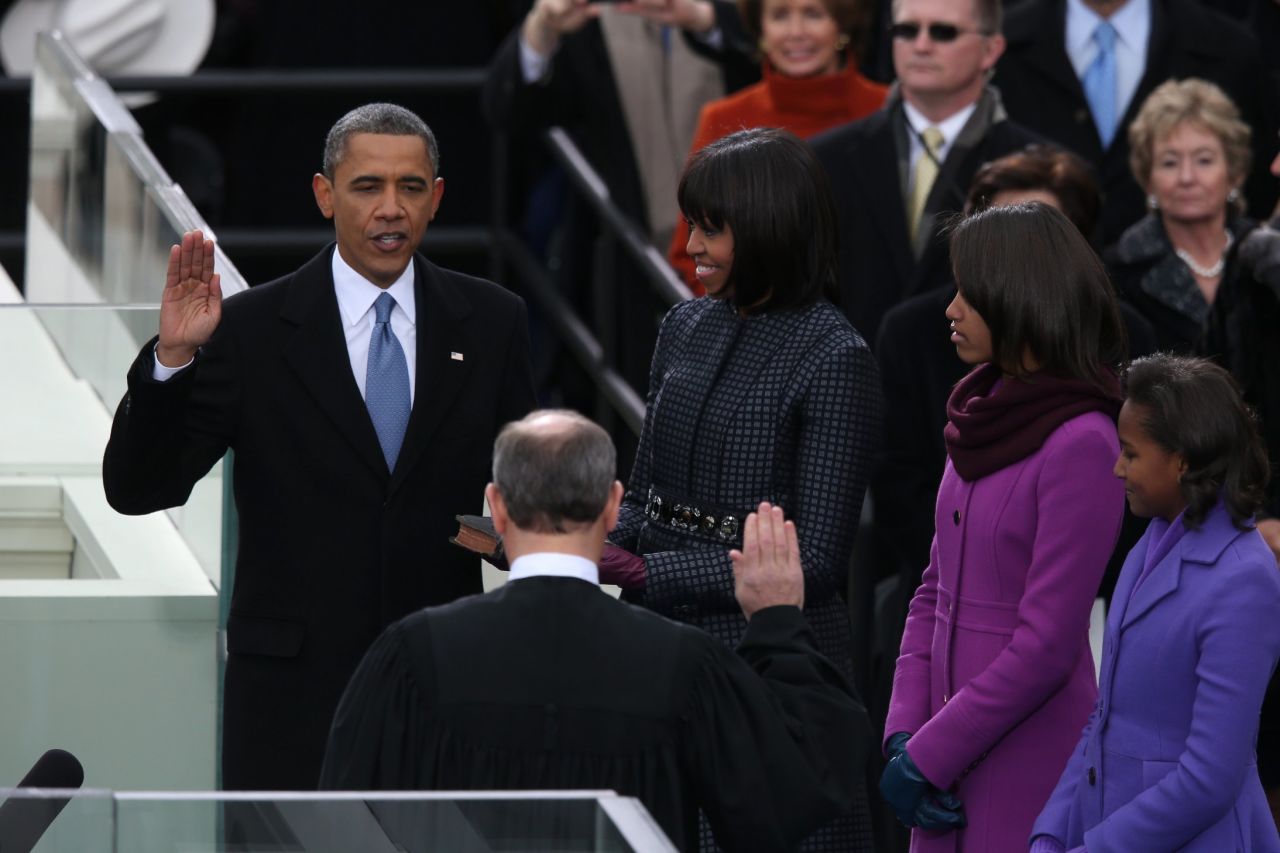 Obama is sworn in by Chief Justice John Roberts as first lady Michelle Obama and daughters Malia and Sasha watch on Monday, January 21.