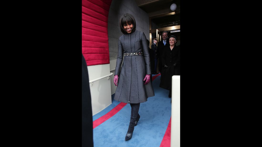 For Inauguration Day in 2013, the first lady mixed "high" and "low" fashion with a belt from J. Crew, a coat and dress by Thom Browne, Reed Krakoff boots and a necklace by Cathy Waterman, the White House said. After the festivities, the outfit and accessories were to go to the National Archives.