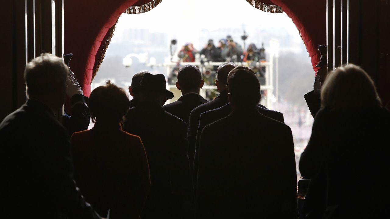 Obama, center, pauses before walking out the door of the U.S. Capitol to begin swearing-in ceremonies on January 21.