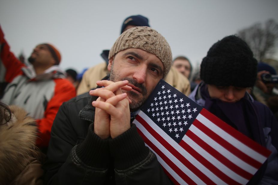 Igor Naumovski is among the flag-waving celebrants on the National Mall during the inauguration ceremony on Monday, in Washington. 
