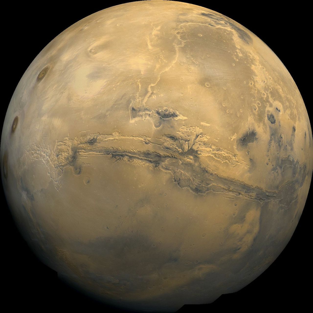 The Valles Marineris, shown in this composite image of Mars, is similar to Arizona's Grand Canyon, except it's as long as the U.S. is wide. Scientists theorize that water might have carved canyons like Valles Marineris after asteroids slammed into the Martian surface and melted underground ice. 