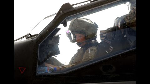 Harry sits inside an Apache helicopter at Camp Bastion on October 31, 2012.
