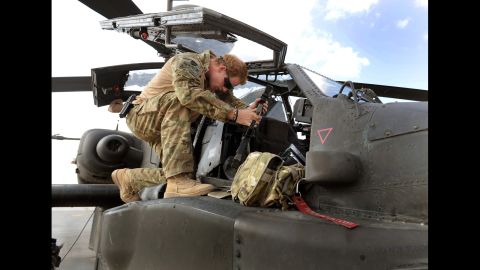 Harry services an Apache helicopter on October 31, 2012.
