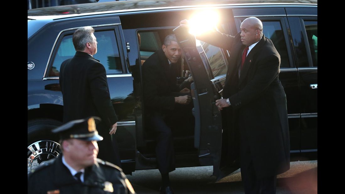 President Obama exits his limousine to walk 