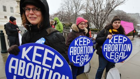 Young women hold placards during a pro-choice rally outside of the Supreme Court in Washington last year. 