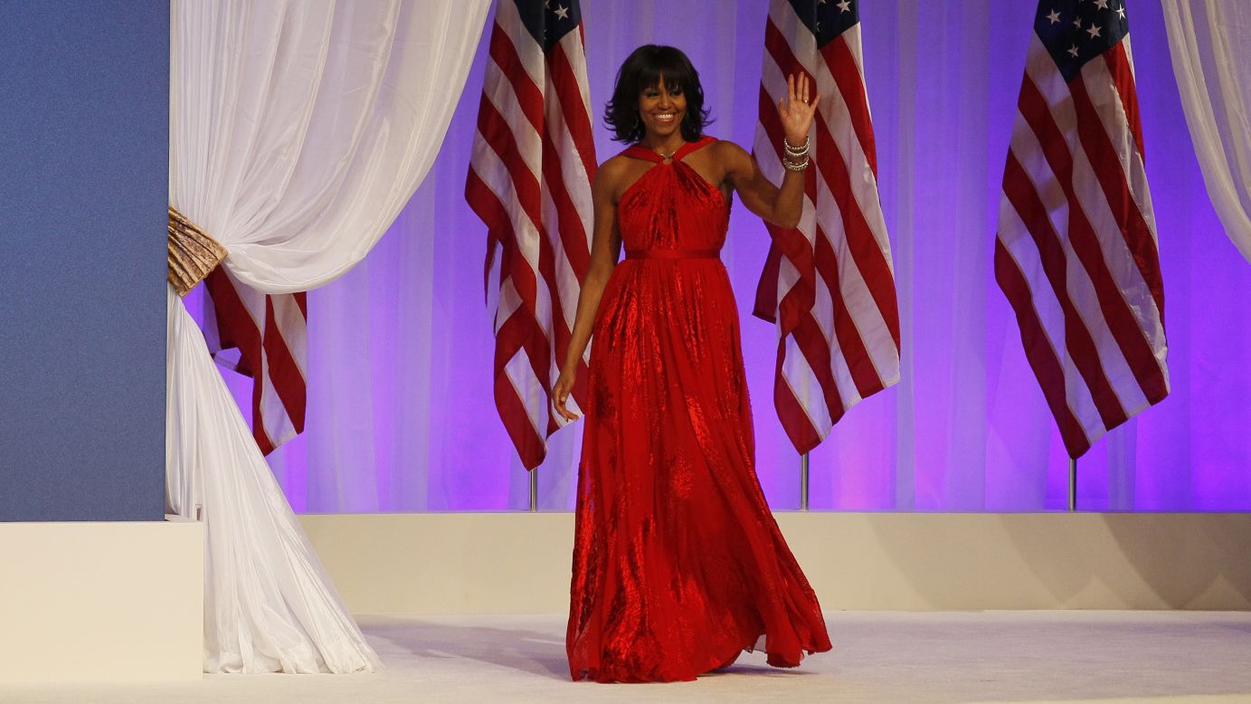 Michelle Obama is introduced at the Commander-in-Chief's Ball on Monday. She wore a floor-length, custom, ruby-colored chiffon and velvet gown designed by Jason Wu, the same designer behind her 2009 inaugural dress.