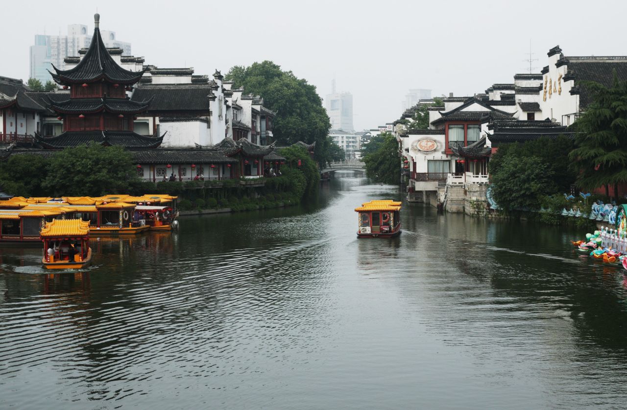 Sightseeing boats on the Qinhuai River pass close to Nanjing's Confucius Temple -- an example of the city's diverse architecture.