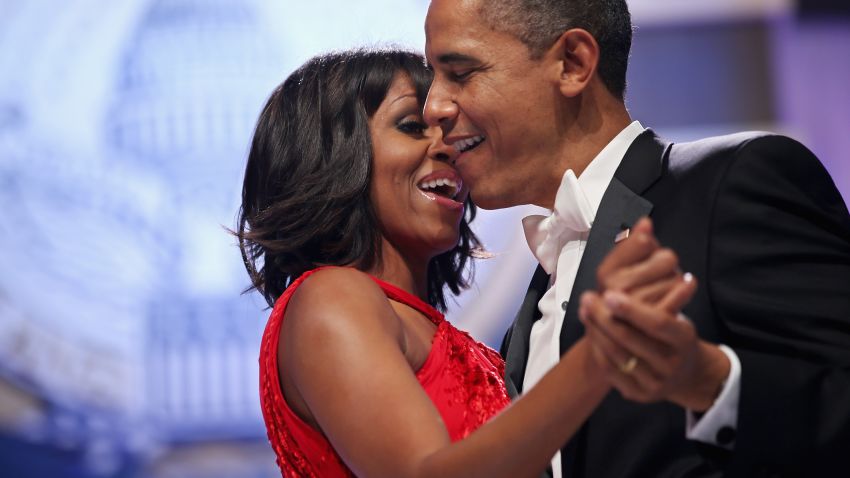 President Barack Obama and first lady Michelle Obama sing together as they dance during the Commander-in-Chief's Ball in Washington on Monday, January 21.