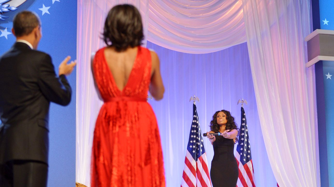 The Obamas applaud singer Jennifer Hudson after their first dance.