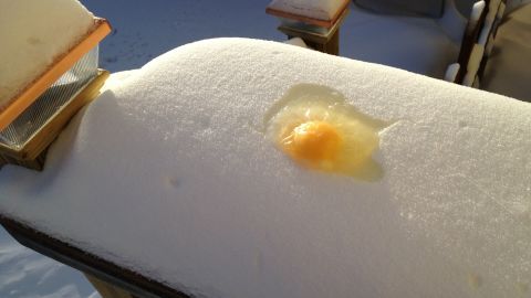 Minnesotan Funda Ray sprayed a cookie pan with Pam and broke an egg on it in the cold. Within a half hour, the egg was frozen. 