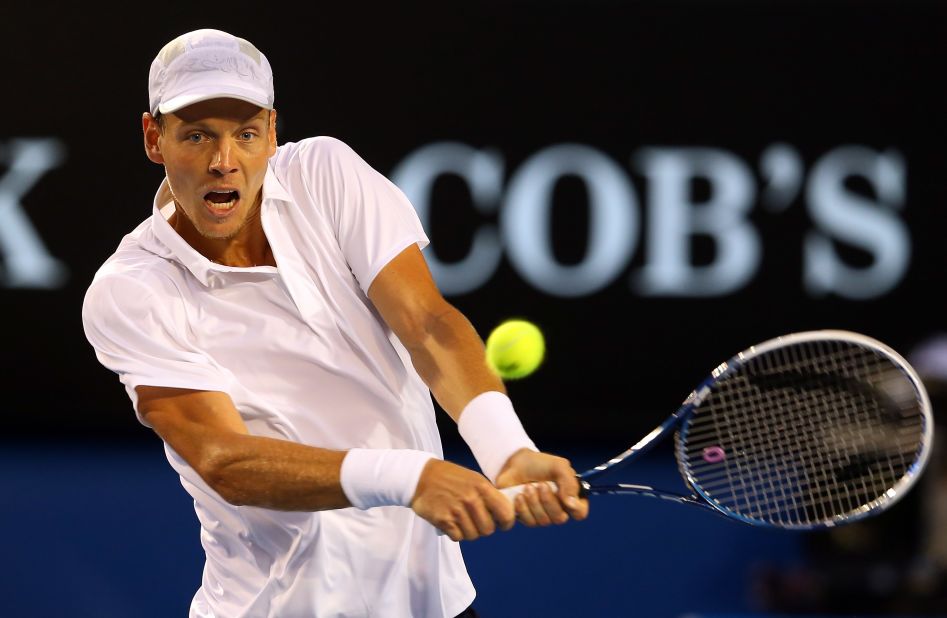 Berdych plays a backhand in his match against Djokovic on January 22.