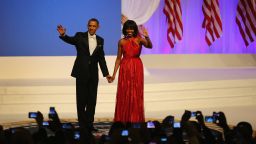 WASHINGTON, DC - JANUARY 21:  U.S. President Barack Obama and first lady Michelle Obama greet the crowd at the Commander-In-Chief's Inaugural Ball January 21, 2013 in Washington, DC. Obama was sworn in today for his second term in a public ceremonial swearing in.  (Photo by Joe Raedle/Getty Images)