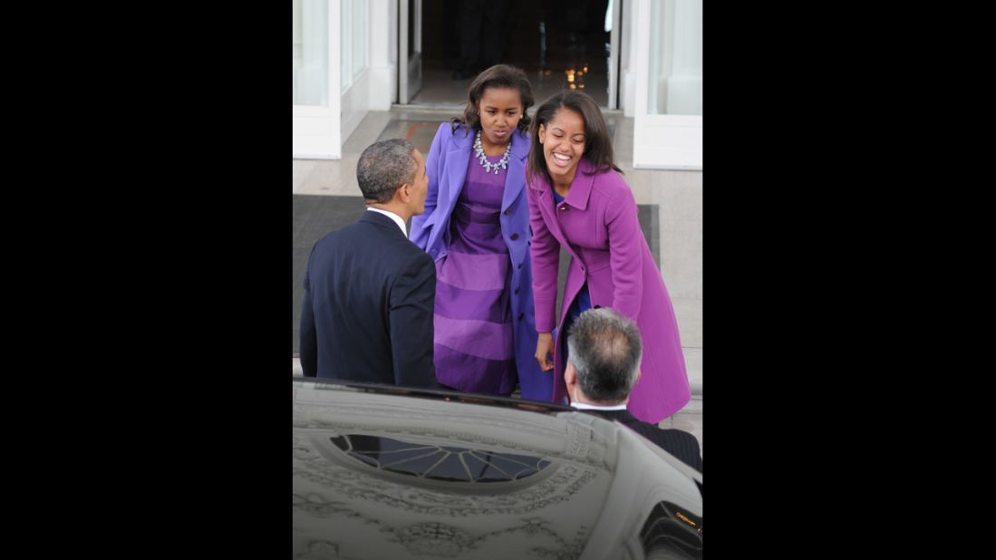The president and his daughters return to the White House from prayer services at St. John's Episcopal Church on January 21.