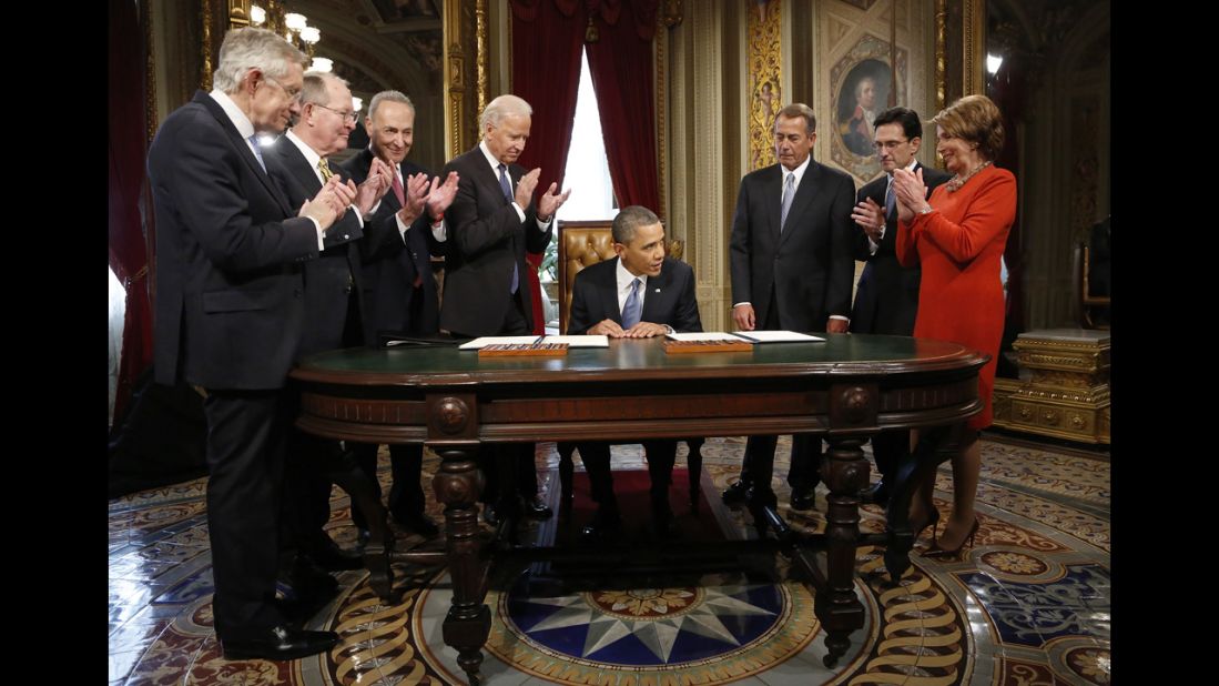 Senate and House leaders and Vice President Joe Biden applaud the president after he signs a proclamation to commemorate the inauguration on January 21.