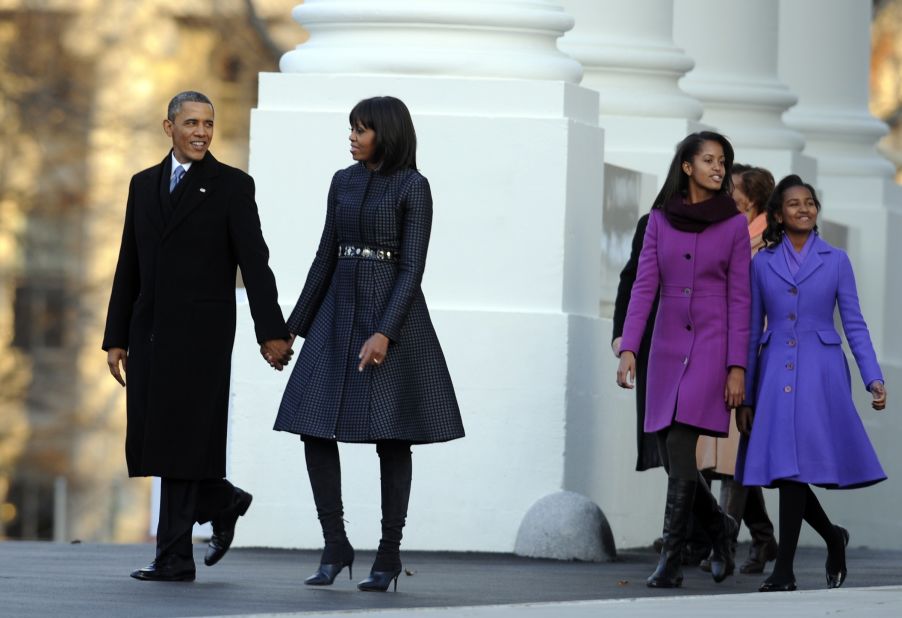 The Obamas walk to the reviewing stand for the inaugural parade January 21.